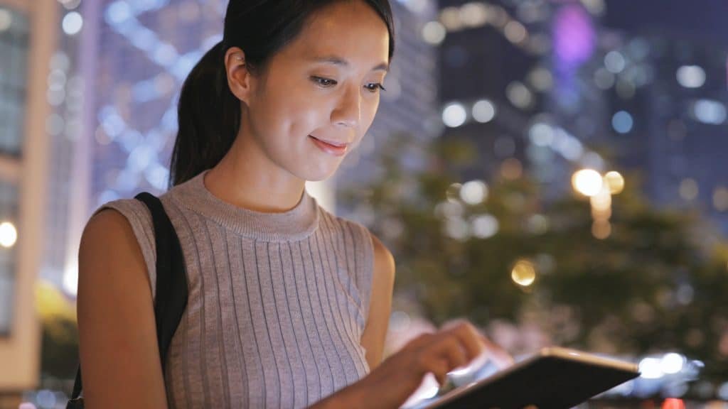 Young woman using digital tablet